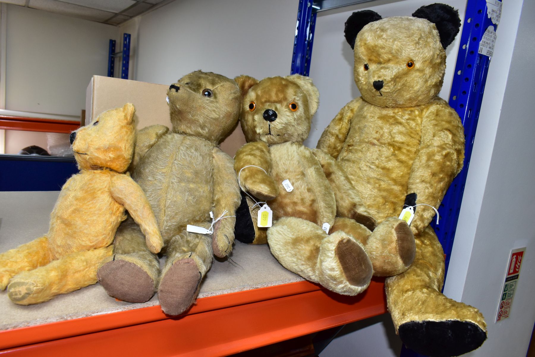 FOUR TEDDY BEARS, comprising a 33cm fully jointed vintage bear with plastic eyes and nose, rexine