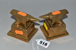 A PAIR OF MINIATURE BRASS ANVILS, on removable brass bases, total height 7cm x width 8.5cm (