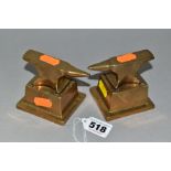 A PAIR OF MINIATURE BRASS ANVILS, on removable brass bases, total height 7cm x width 8.5cm (