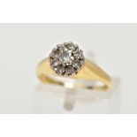 AN 18CT GOLD DIAMOND CLUSTER RING, comprising of nine round brilliant cut diamonds, approximate