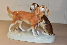 A ROYAL DUX FIGURE GROUP OF TWO HOUNDS, impressed no. 303 2 75, applied pink triangle mark,