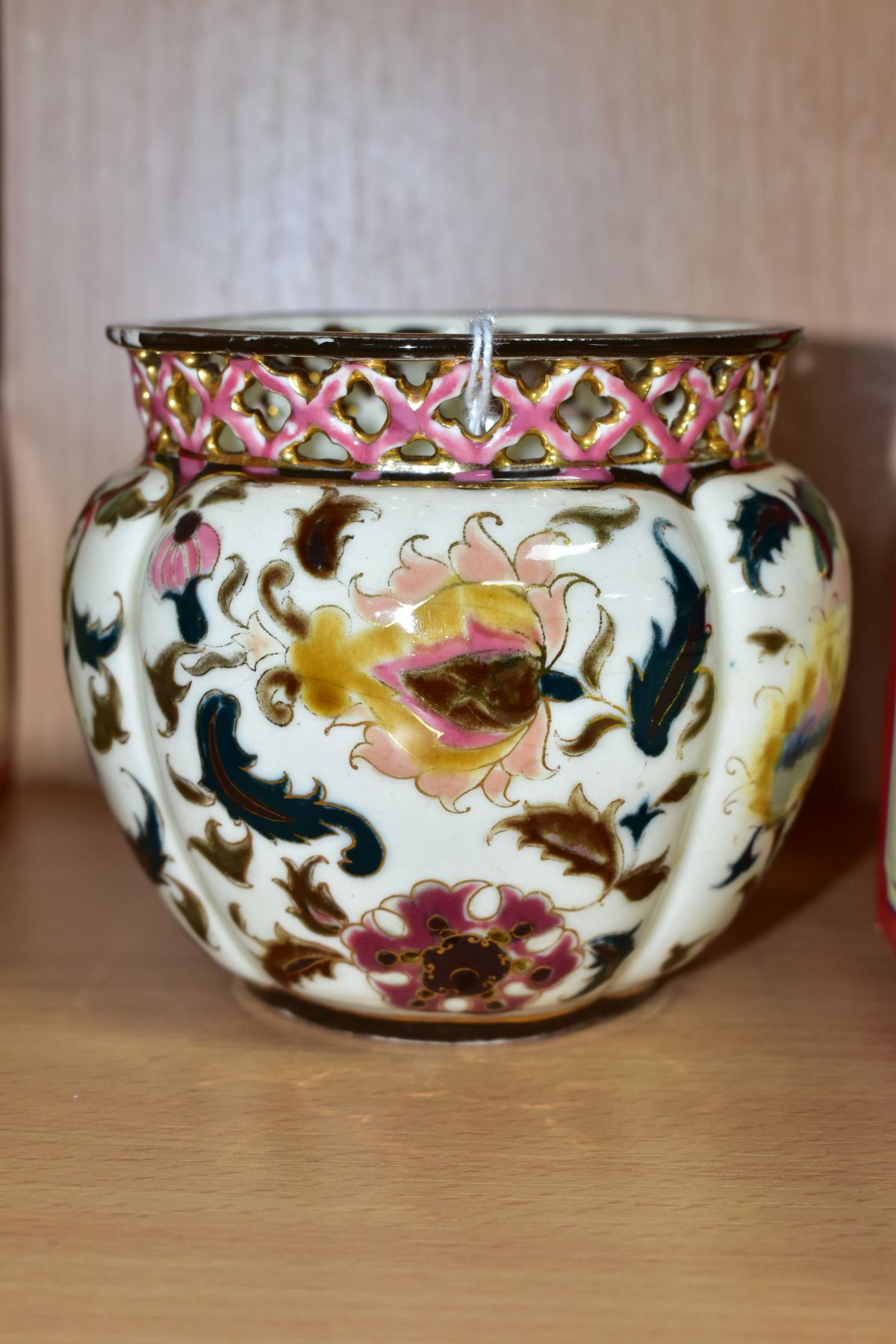 A SMALL ZSOLNAY PECS PLANTER, with pierced rim, florally decorated, blue faded factory mark to