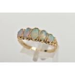 A 9CT GOLD OPAL RING, comprising of three oval and two round opals prong set, leading onto a