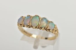 A 9CT GOLD OPAL RING, comprising of three oval and two round opals prong set, leading onto a