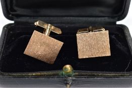 A PAIR OF 9CT GOLD CUFFLINKS, each of a rectangular form with a textured bark effect, approximate
