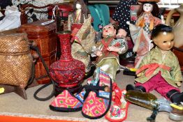 A GROUP OF ORIENTAL DOLLS AND BASKETS, to include six dolls, a vintage composition boy doll (sd to