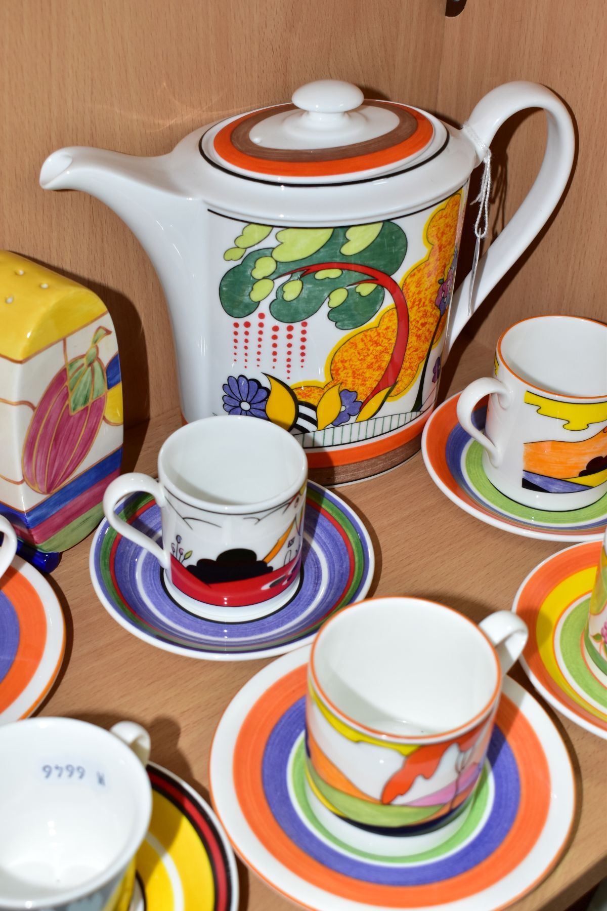 A WEDGWOOD CLARICE CLIFF COFFEE POT, SUGAR SIFTER AND SIX COFFEE CANS AND SAUCERS, comprising a - Image 2 of 7