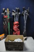 A COLLECTION OF GOLFING EQUIPMENT to include two golf bags containing clubs such as Mizuno,