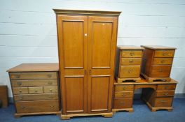 A YOUNGER CHERRYWOOD PIECE BEDROOM SUITE comprising three bedside cabinets, dressing table, width