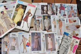 APPROXIMATELY TWENTY SIX VINTAGE VOGUE DRESSMAKING PATTERNS, to include Career Woman, American