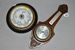 A CIRCULAR OAK CASED ANEROID BAROMETER, approximate diameter 23cm, together with an oak