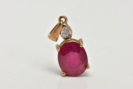 A YELLOW METAL RUBY PENDANT, an oval cut ruby, approximate dimensions length 11mm x width 9mm, set