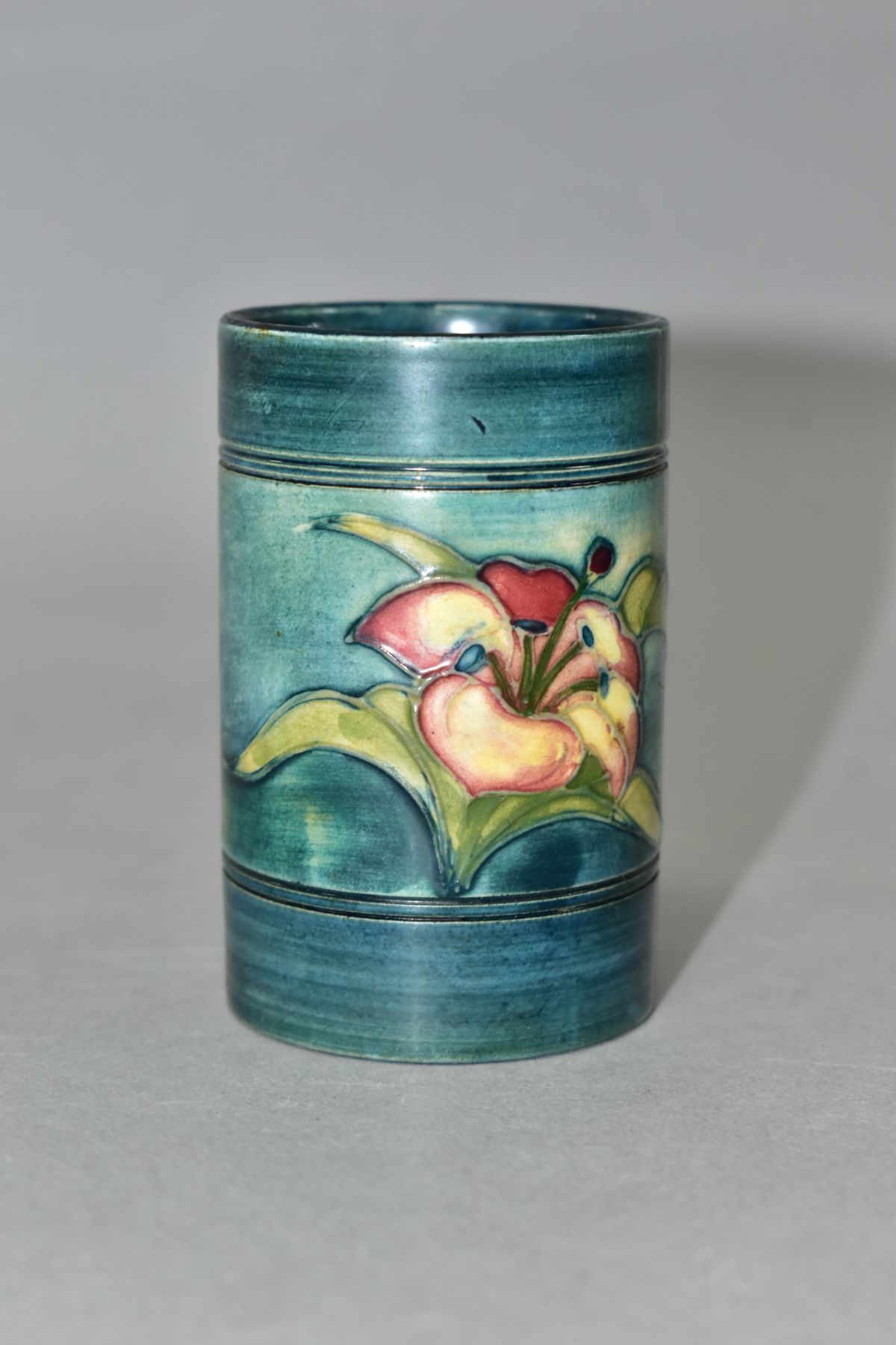 A MOORCROFT POTTERY CYLINDRICAL VASE, banded and decorated with tube lined Freesias on a blue - Image 3 of 6