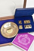 A CASED SET OF CORONATION SILVER STAMPS AND A CASED DISH, blue cased set of four coronation silver