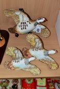 A SET OF THREE GRADUATED BESWICK PINK LEGGED PARTRIDGE WALL PLAQUES, nos1188/1, 1188/2 and 1188/3 (