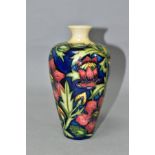 A MOORCROFT POTTERY PHEASANTS EYE VASE, of baluster form with a short cylindrical neck, with