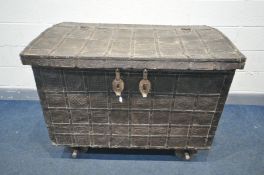 AN ANTIQUE ANGLO-INDIAN HARDOOD TRUNK ON WHEEL, with cross hammered and forged iron strappings,