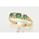 AN EMERALD AND DIAMOND RING, three circular cut diamonds set with four round brilliant cut diamonds,