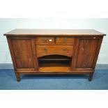 A CHARLES BARR CHERRYWOOD SIDEBOARD, with double cupboard door flanking and arrangement of drawers