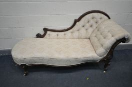 A VICTORIAN WALNUT CHAISE LONGUE, upholstered in cream buttoned upholstery, length 186cm