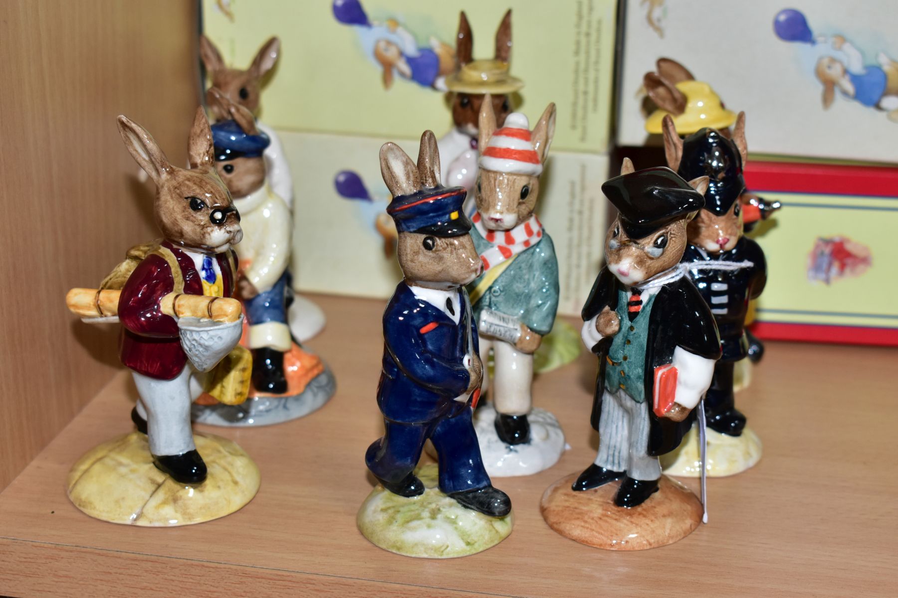 NINE BOXED ROYAL DOULTON BUNNYKINS FIGURES, comprising School Master DB60, Policeman DB64, Fireman