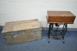 A VINTAGE TREADLE SEWING MACHINE, with a mahogany box lid, (with no sewing machine) and a distressed