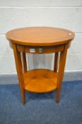 A CHERRYWOOD OVAL LAMP TABLE, with a single drawer, four legs united by an undershelf, labelled '