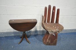 A DISTRRESSED CARVED WOODEN SEAT IN THE SHAPE OF A HAND, height 91cm and a Strongbow mahogany drop