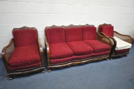 AN EARLY 20TH CENTURY WALNUT THREE PIECE BERGERE LOUNGE SUITE, comprising a three seater settee,