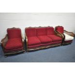 AN EARLY 20TH CENTURY WALNUT THREE PIECE BERGERE LOUNGE SUITE, comprising a three seater settee,