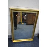 A GILT FRAMED BEVELLED EDGE WALL MIRROR, 106cm x 75cm