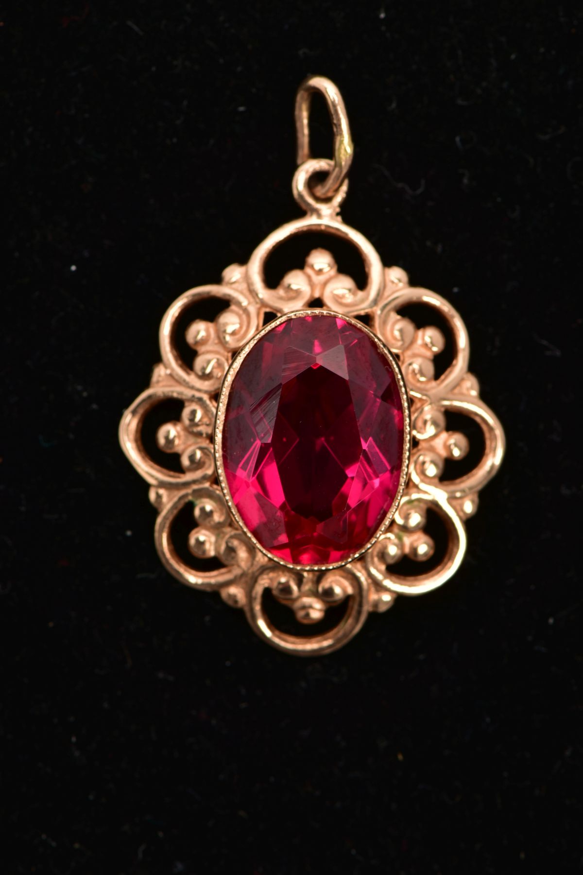 A YELLOW METAL SYNTHETIC RUBY PENDANT, designed with a central oval cut synthetic ruby, - Image 5 of 5