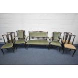 AN EDWARDIAN MAHOGANY SEVEN PIECE SALON SUITE, comprising a sofa with open armrests, length 125cm,