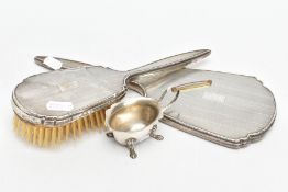 A SILVER VANITY MIRROR AND HAIR BRUSH WITH A SILVER SALT, the hand held mirror and matching hair