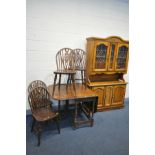 AN OAK GATE LEG TABLE, open leaves 136cm x closed length 49cm x depth 92cm x height 75cm, and four