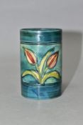 A MOORCROFT POTTERY CYLINDRICAL VASE, banded and decorated with tube lined Freesias on a blue