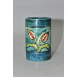 A MOORCROFT POTTERY CYLINDRICAL VASE, banded and decorated with tube lined Freesias on a blue