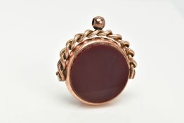 A LARGE LATE 19TH CENTURY 9CT GOLD SWIVEL FOB, a round fob set with blood stone and carnelian in a