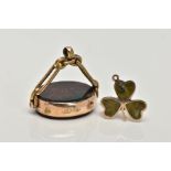 A 9CT GOLD BROOCH AND A YELLOW METAL FOB, clover brooch inlayed with jadeite, also fitted with a