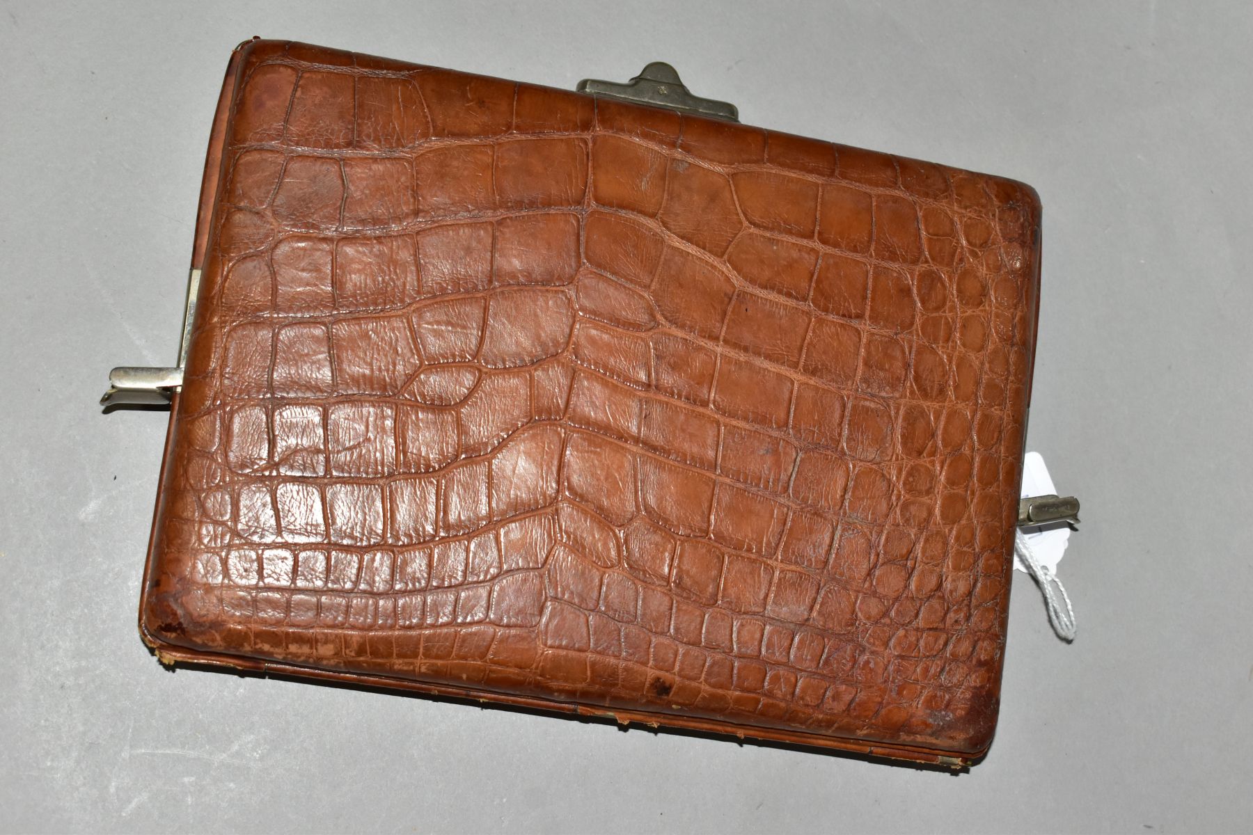 A TAN CROCODILE SKIN WRITING CASE, the cover embossed in gilt H.C.E., bears label for Ward to the - Image 4 of 7
