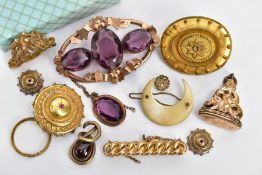 AN ASSORTMENT OF VICTORIAN YELLOW METAL BROOCHES, to include an open work rose metal and purple
