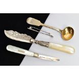 THREE SILVER ITEMS AND A GOLFING BROOCH, to include a silver fiddle pattern sauce spoon, engraved