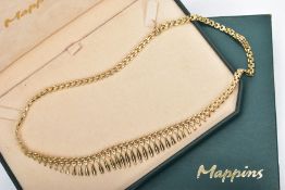A YELLOW METAL ARTICULATED FRINGE NECKLACE, graduated lozenge shape fringe, to a gate style chain