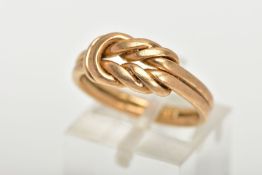 A YELLOW METAL DOUBLE KNOT RING, a double band featuring a decorative double knot, plain polished