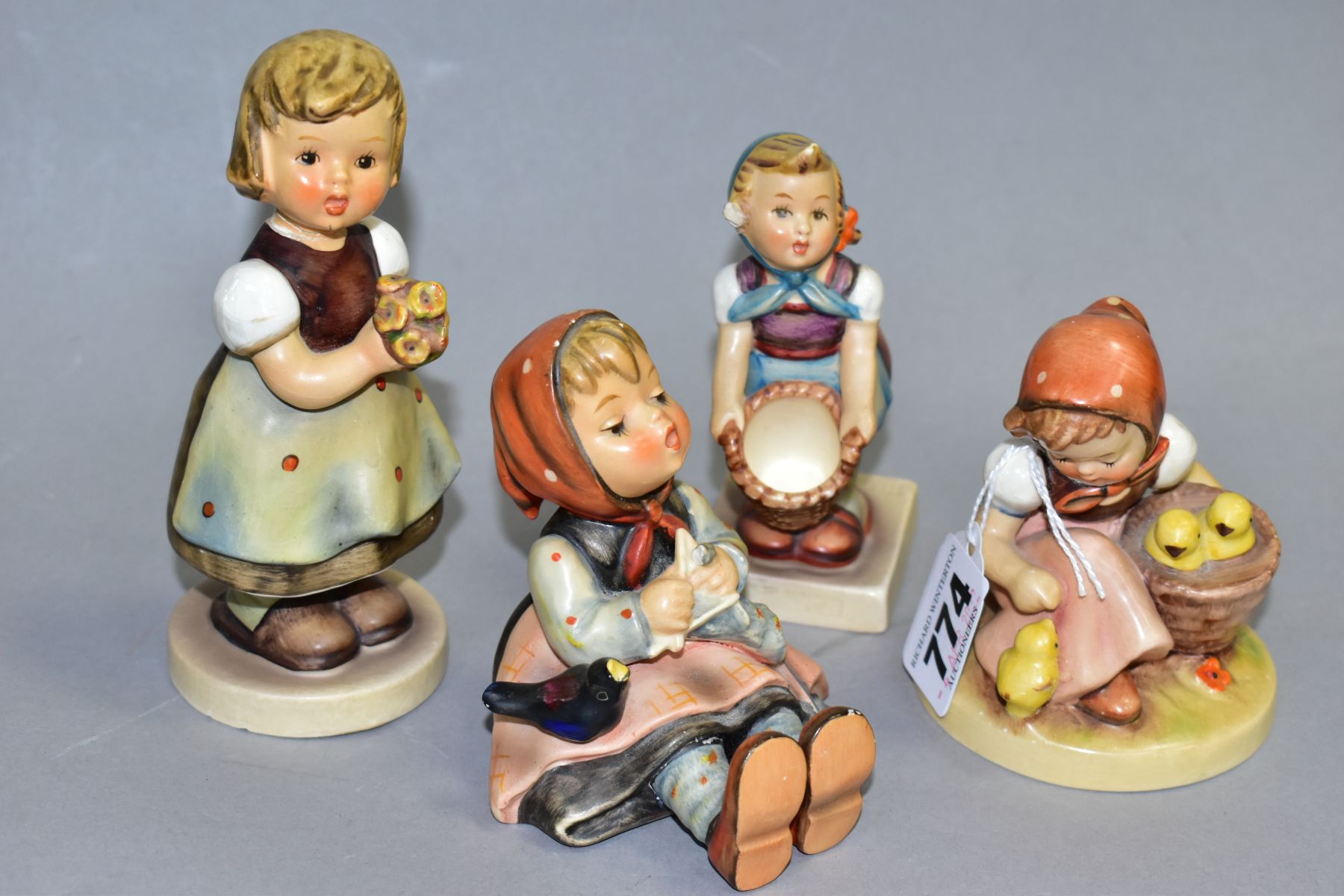 FOUR HUMMEL FIGURES, Chick Girl HUM57 (glaze crazed to base), Happy Pastime HUM69 (chipped beak),