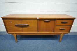 A MID CENTURY TEAK SIDEBOARD, possibly by Jentique, with double cupboard doors, fall front door