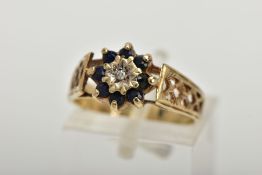 A 9CT GOLD SAPPHIRE AND DIAMOND CLUSTER RING, set with a central illusion set single cut diamond