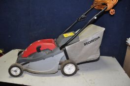 A HONDA HRE 370 LAWNMOWER electric lawn mower with grass box and a Qualcast Panther 30 push along