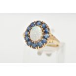 A 9CT GOLD, OPAL AND BLUE STONE RING, an oval opal approximate dimensions length 8mm x width 6mm,