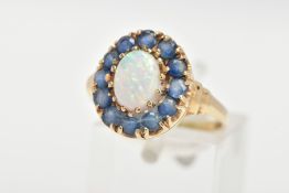 A 9CT GOLD, OPAL AND BLUE STONE RING, an oval opal approximate dimensions length 8mm x width 6mm,